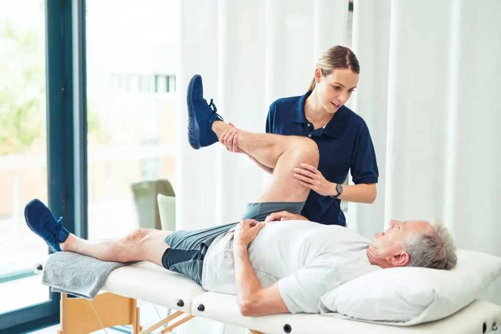 Revitalising Recovery: Effective Rehabilitation Strategies for Muscle Injuries 3 Physiotherapist assisting a patient with muscle recovery exercises Warwickshire