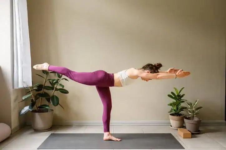 Achieving the Perfect Tone: How Often Should You Exercise for Results? 1 Woman doing Yoga exercise Warwickshire to help with toning the body.